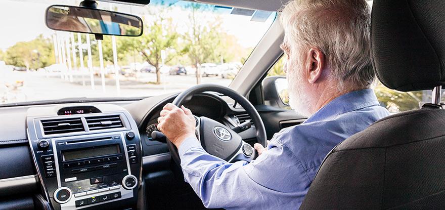 Canberra Elite Taxi driver driving a taxi